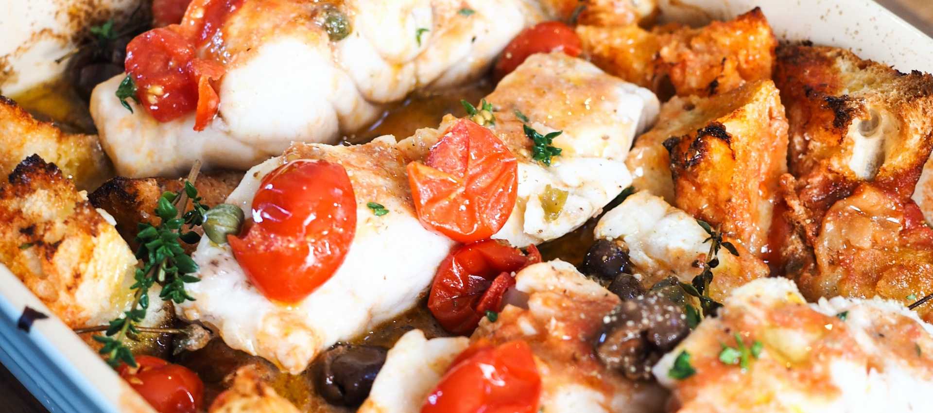 Baked white fish with bread and cherry tomatoes