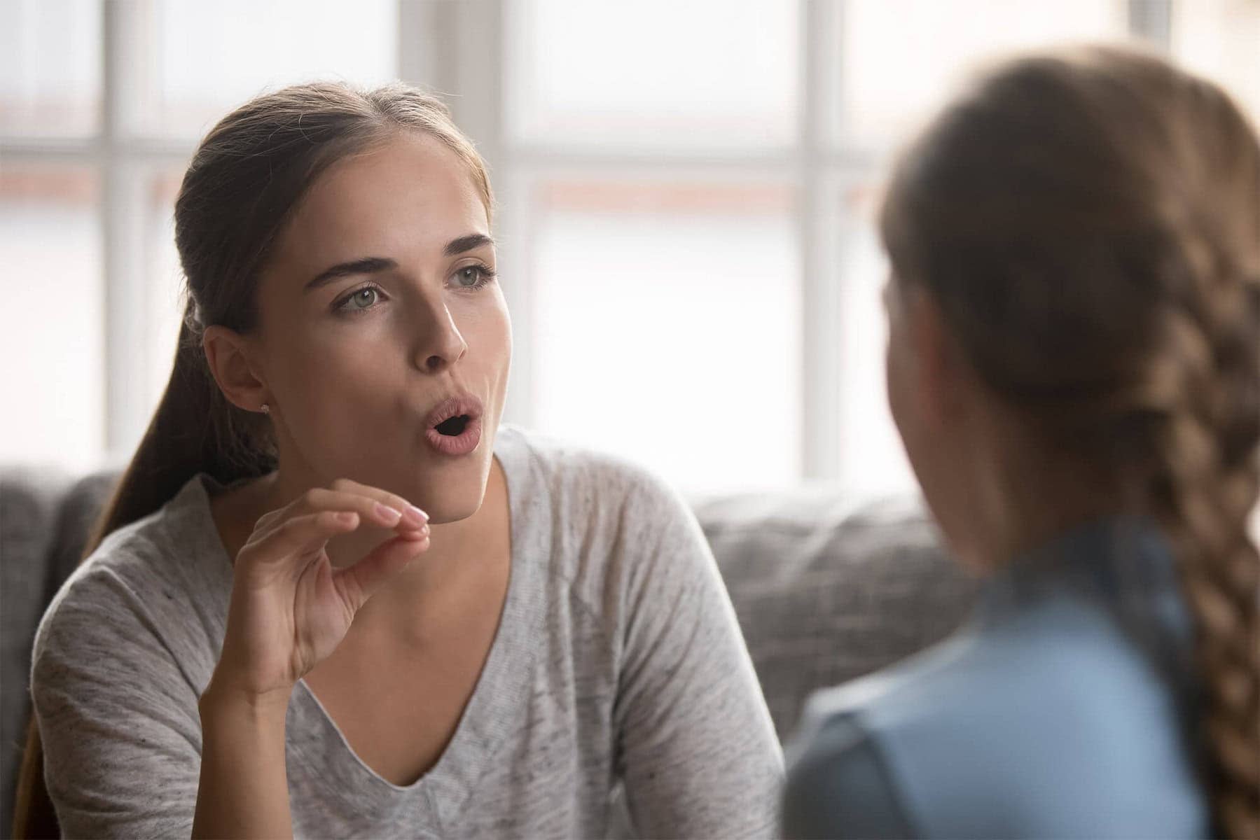 Speech therapist working with client