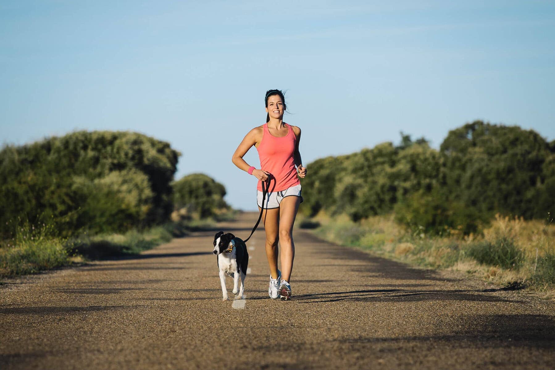 woman running down road