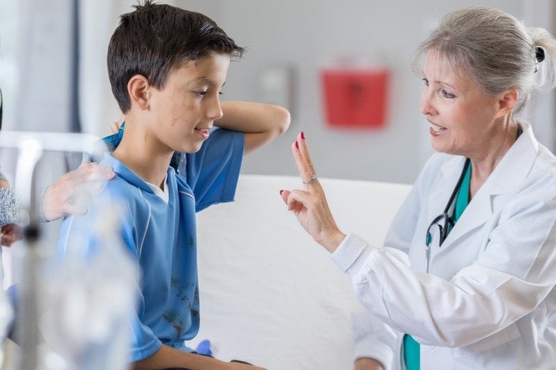 Occupational therapist guiding patient in concussion rehabilitation session