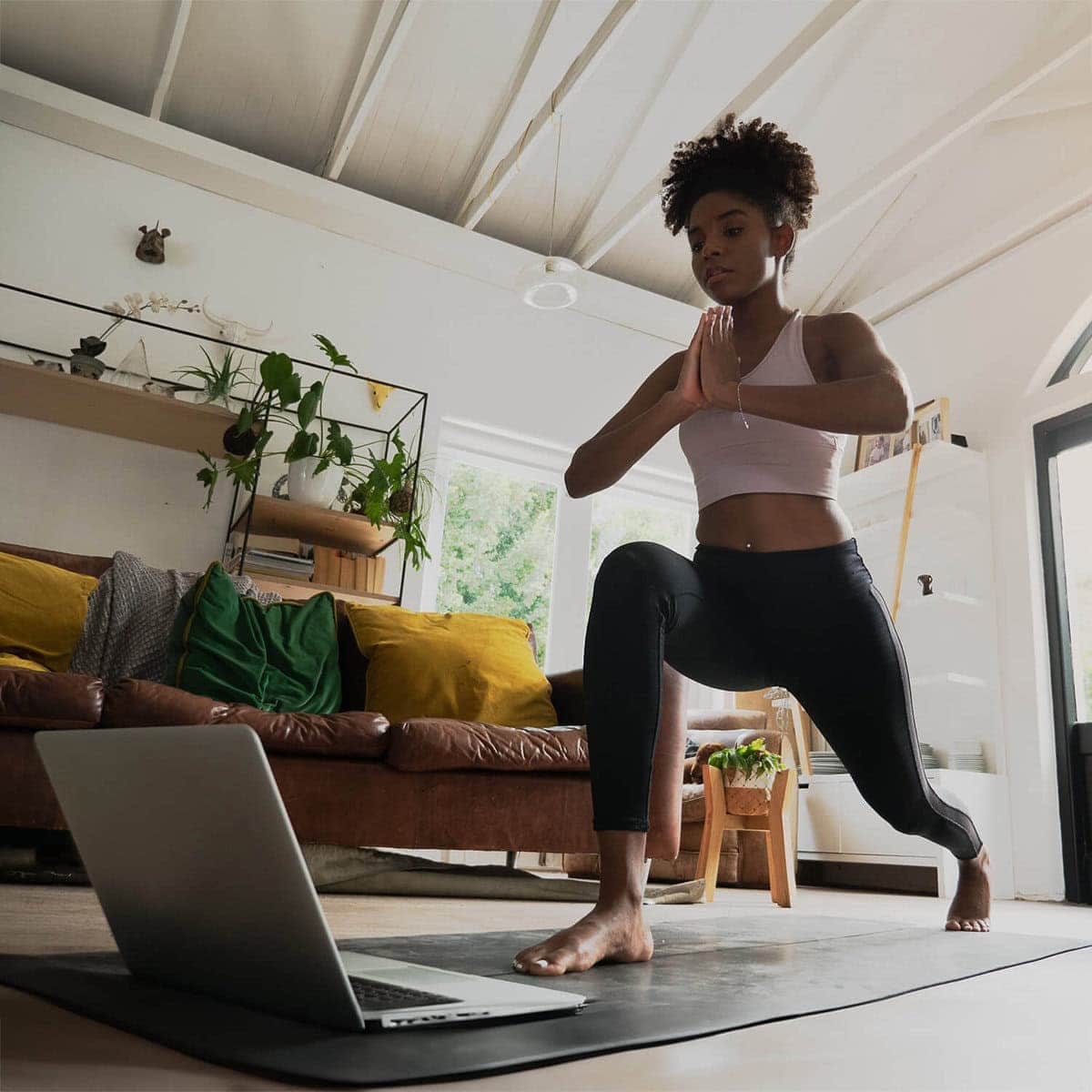 Therapist guiding yoga session in wellness studio setting