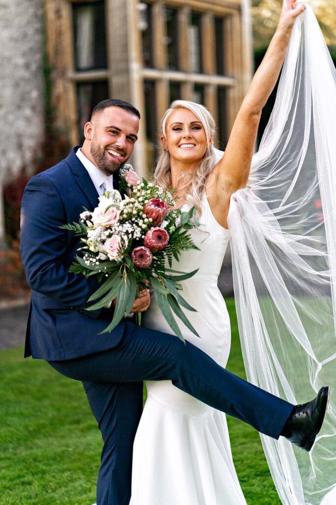 Bride and groom having fun at Foxhills Golf Club