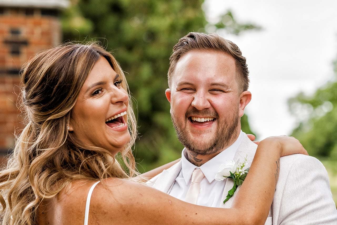 Bride and groom laughing on a wedding day