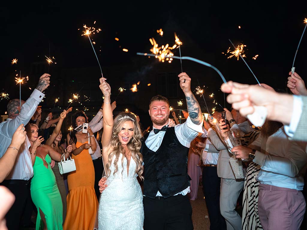 bride and groom with sparklers