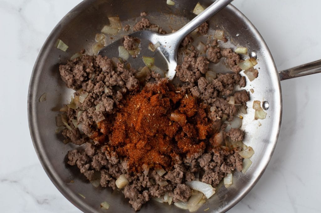 Ground beef with taco seasoning in skillet