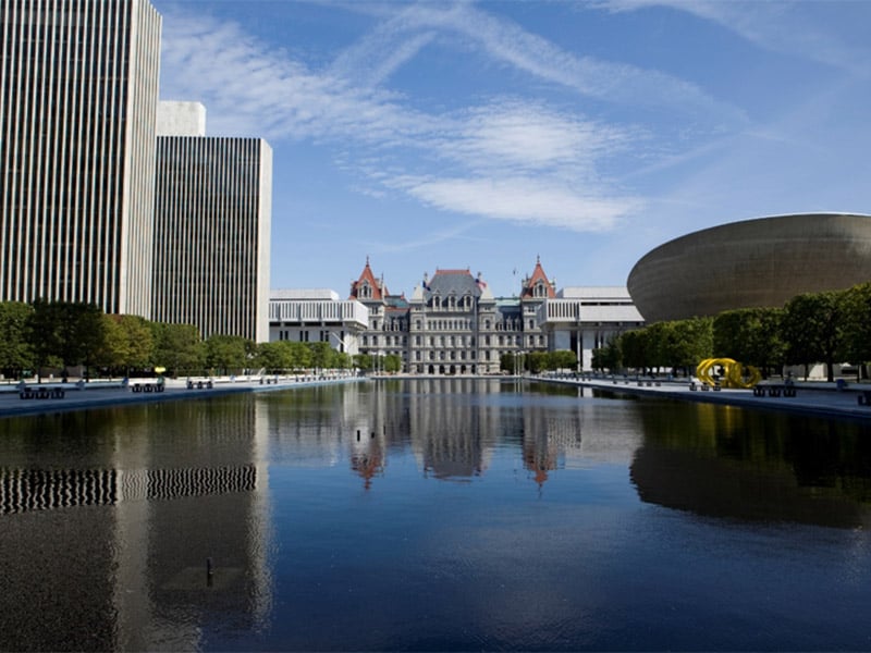 Albany capital building, egg on right, pond at center