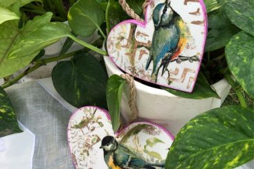 Cute decoupage hanging hearts with birds