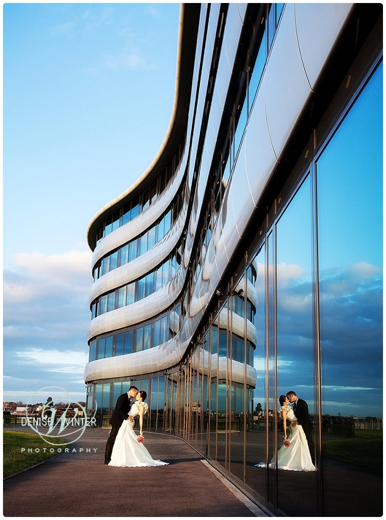 Bride and grrom outside the aviator hotel at sunset
