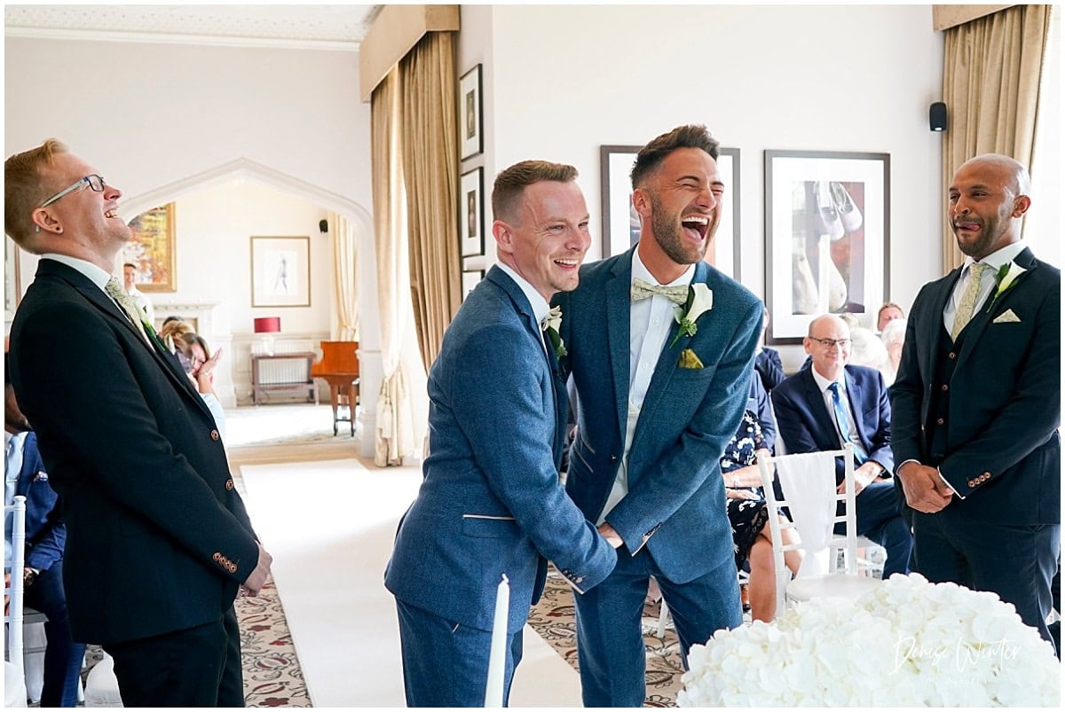 two grooms getting ready 