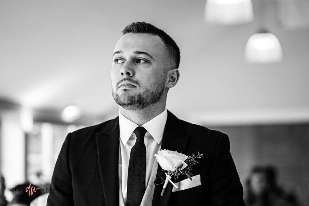 Groom looking nervous waiting for his bride at wasing park