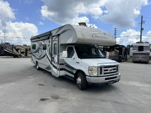 2014 Thor Chateau 28Z Class C RV parked at dealership lot.