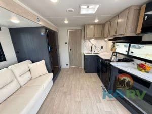 Interior of 2026 Acclaim 2500RD RV with kitchen and seating area.