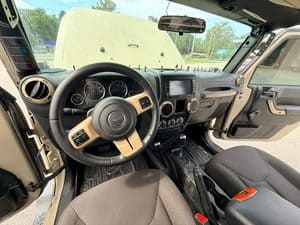 Interior view of a 2016 Entegra Cornerstone 45B RV dashboard and steering wheel.