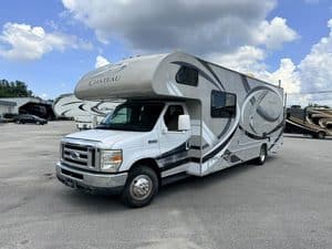 2014 Thor Chateau 28Z Class C RV parked outdoors with blue sky.