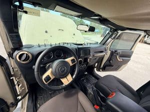 Interior view of 2016 Entegra Cornerstone RV dashboard and seats.
