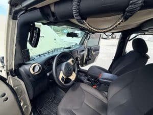 Interior view of a 2016 Entegra Cornerstone 45B RV with dashboard and seats.