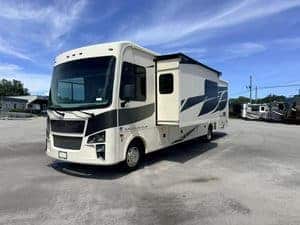 Modern 2023 Coachmen Mirada 35OS RV parked outdoors with slide-out extended.