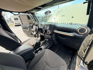 Interior view of a 2016 Entegra Cornerstone 45B RV dashboard and seating.