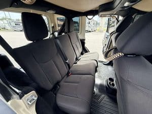 Interior view of 2016 Entegra Cornerstone 45B RV with black seats.