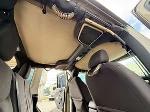 Interior view of 2016 Entegra Cornerstone 45B RV with dashboard and seating.