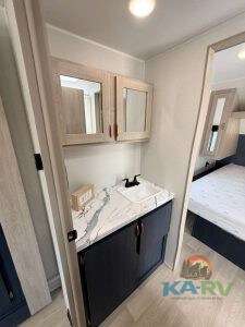 RV bathroom sink with cabinet and mirror in 2026 Acclaim 2500RD.