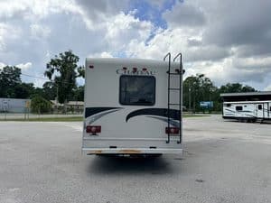Rear view of 2014 Thor Chateau 28Z Class C RV in parking lot.