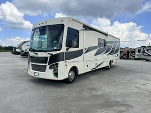 Modern 2023 Coachmen Mirada 35OS motorhome at RV dealership.