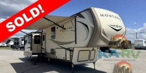 2019 Keystone Montana RV with sold banner, outdoor view, and clear sky.