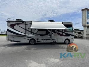 RV with awning extended at KA RV Repair dealership in Optima.