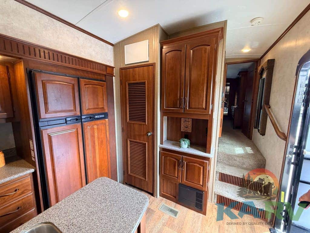 Interior view of RV kitchen and storage cabinets at KA RV Repair.