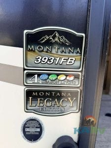 Keystone Montana 3931FB travel trailer logo with mountain graphic.