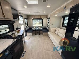 Spacious RV interior with kitchen and seating area for 2026 Acclaim 2500RD.