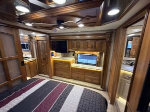 Luxury RV interior with wooden cabinets and modern amenities.