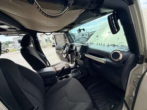 Interior view of 2016 Entegra Cornerstone 45B RV with dashboard and seats.