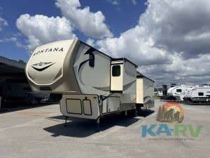Luxury Keystone Montana 3931FB fifth wheel trailer with modern features. Perfect for family trips an.