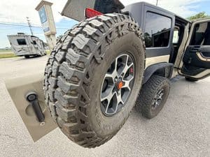 Close-up of rugged off-road tire on 2016 Entegra Cornerstone 45B RV.