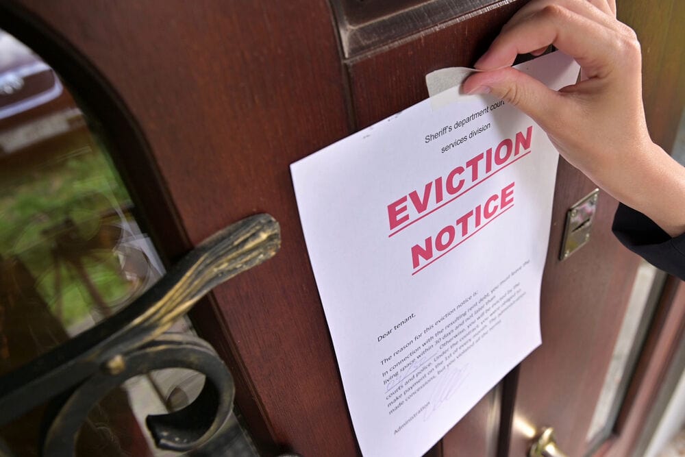 Eviction notice on wooden door