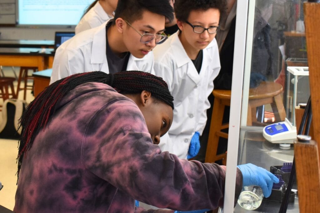 A student pours to create agarose gel.