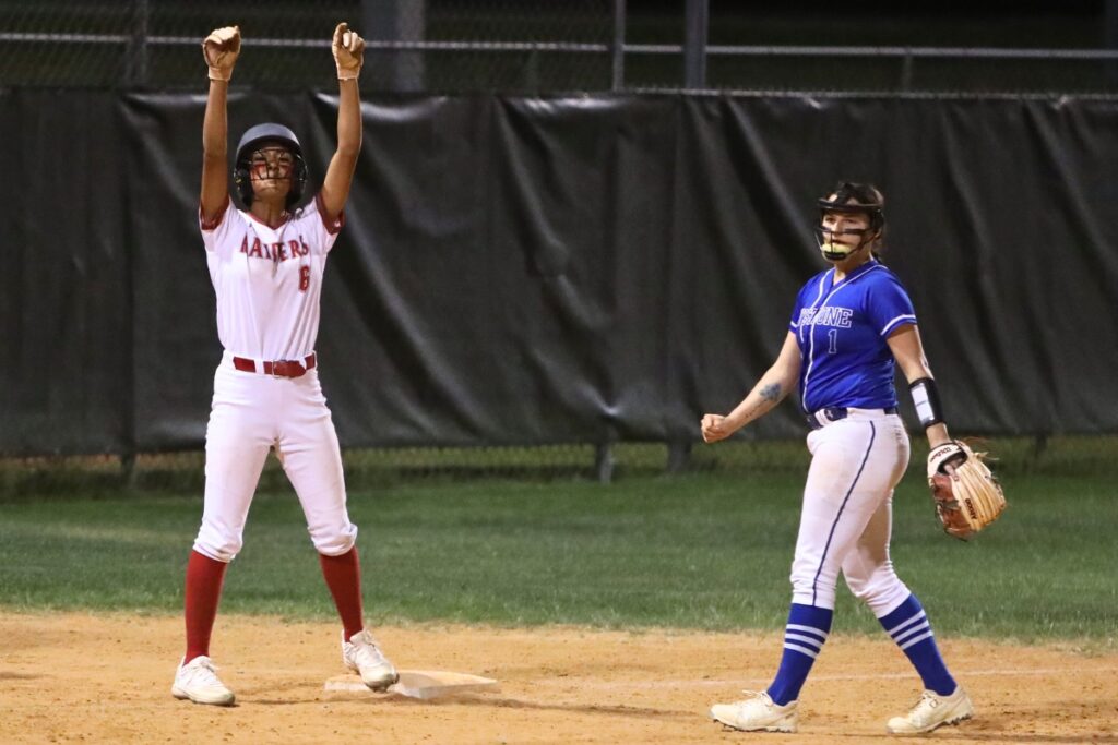 Santa Fe's Madisen Crosby with a triple in the bottom of the seventh inning against Keystone Heights.