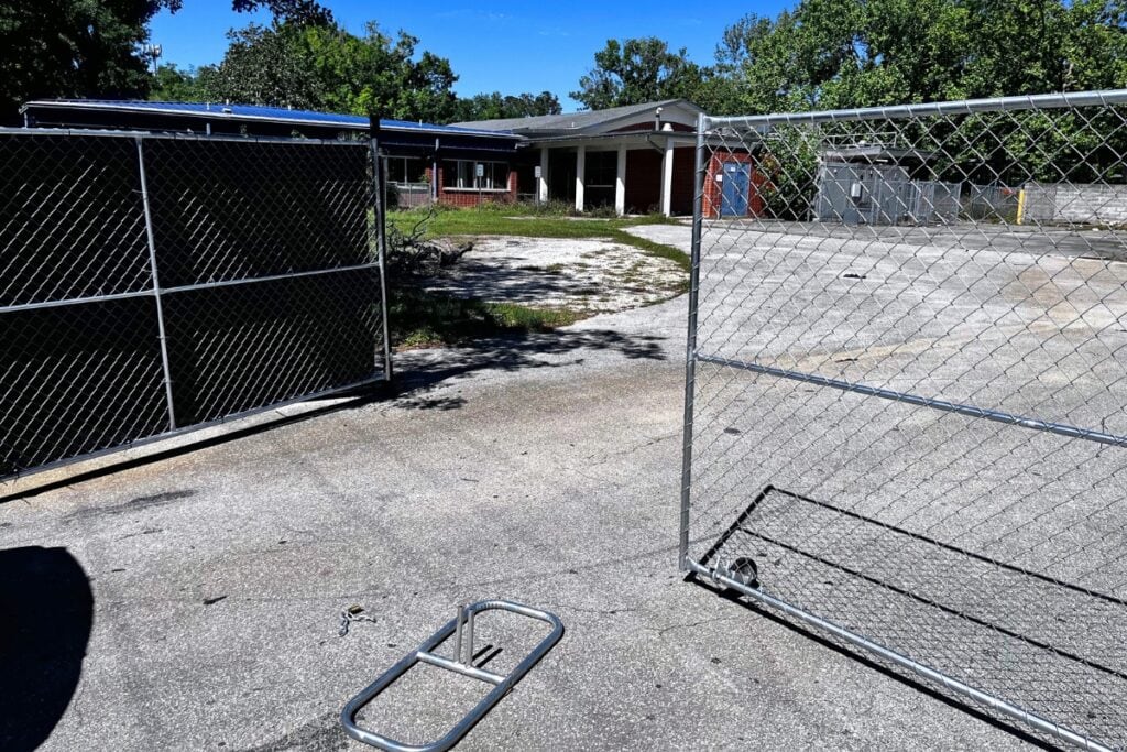 A gate apparently broken into and left wide open at the old Terwilliger Elementary School.