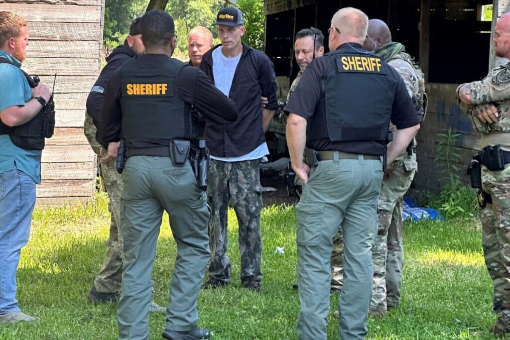 Law enforcement captured Alvin Weeks Jr. (in hat) on Wednesday morning in a barn located in northeast Bradford County and charged him with the premeditated murder of Emory Crews Jr.