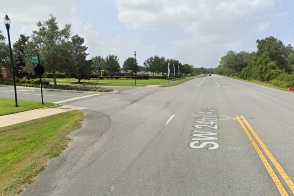 A 78-year-old Gainesville woman died when she collided with a pickup and trailer on SW 24th Avenue on Tuesday afternoon.