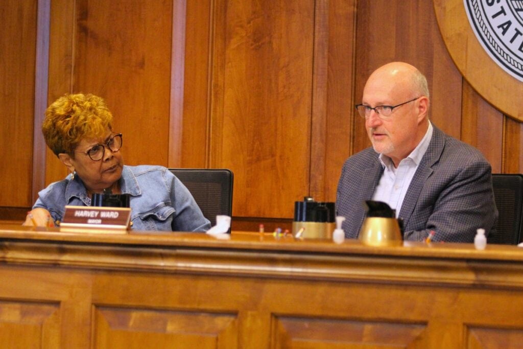 Gainesville Mayor Harvey Ward (right) speaks at a May 7 workshop with Commissioner Cynthia Chestnut.