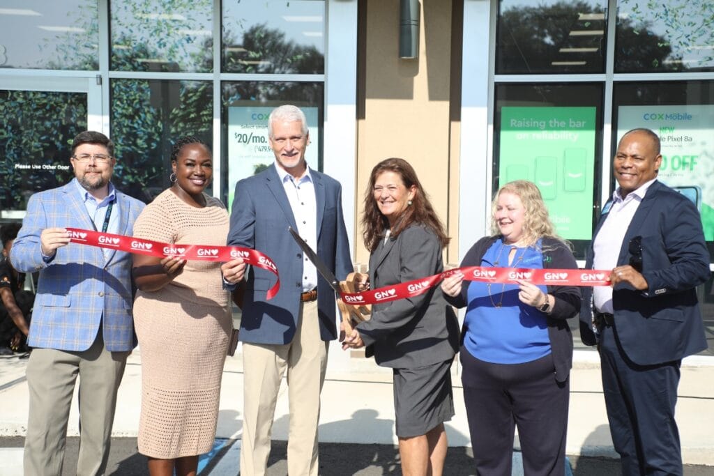 Cox officials and community dignitaries were on hand for Friday morning's ribbon-cutting ceremony at the new Cox retail store on 43rd Street in Gainesville.