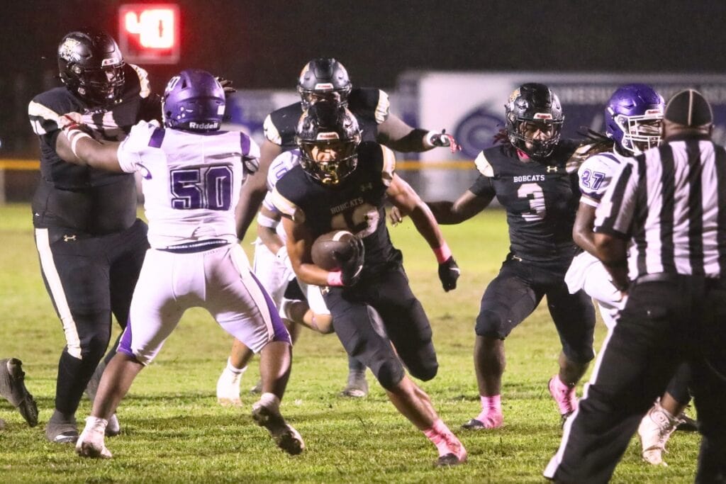 Buchholz's Justin Williams (13) scores a touchown the play after a Gainesville fumble to put the Bobcats ahead 21-7 on Friday.