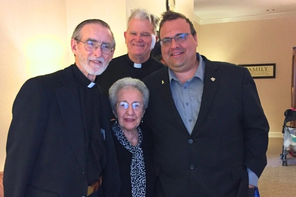 (From left) Fr. Roland Julien, Nancy Bennett, Fr. Jim O'Neal and Burt Wetherington.