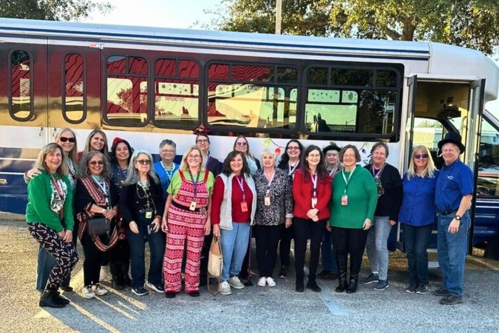 The Wise Women of Gainesville Facebook group line up outside the bus that took them to St. Augustine on Dec. 7 to view the holiday lights in St. Augustine. Courtesy of Wise Women of Gainesville