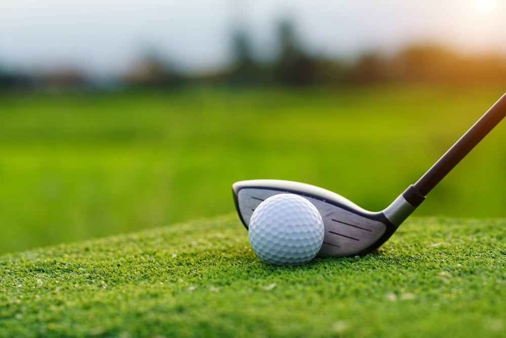 golf ball and club