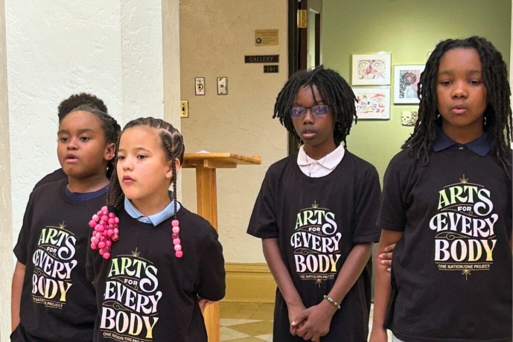 Children from the Caring and Sharing Learning School sing at the Matthew Lewey Intergenerational Event at the Thomas Center on Sunday. Photo by Ronnie Lovler