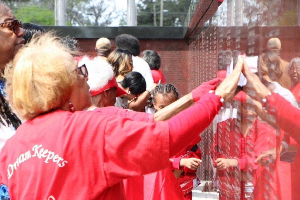 Lincoln High School Memorial Wall attendees find their names and names of loved ones on the wall. Photo by Lillian Hamman